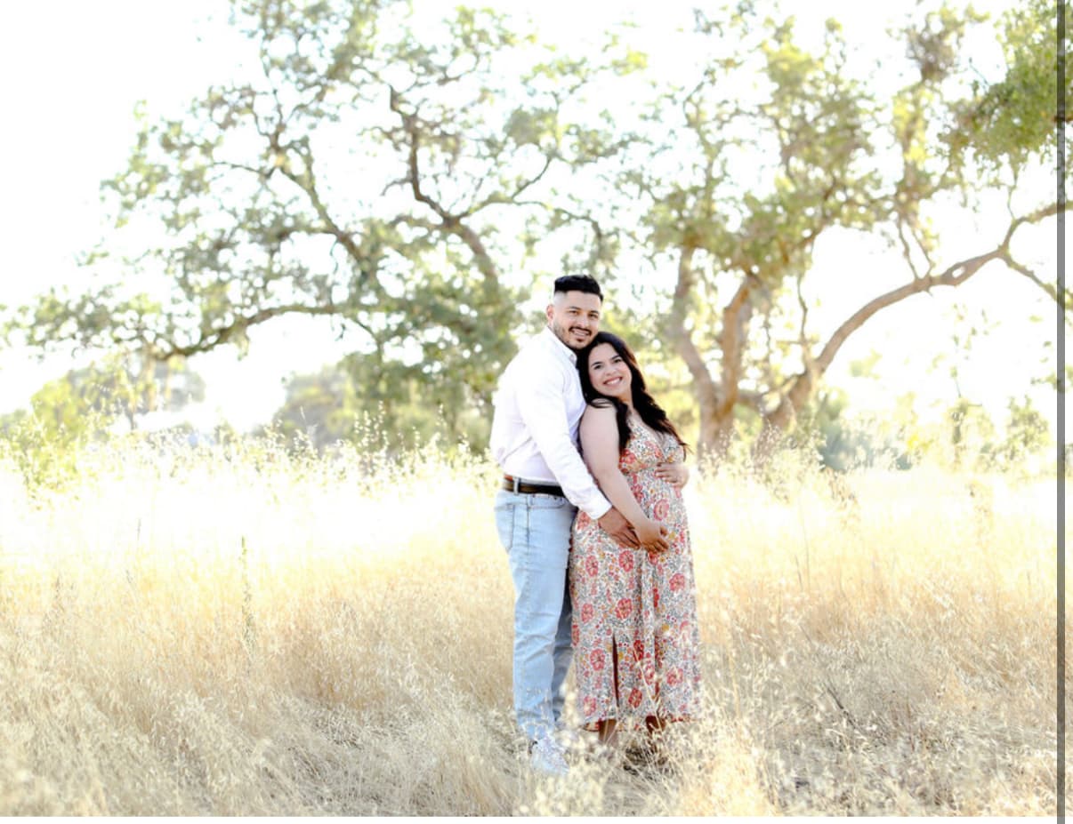 Noemi 'Mimi', founder of Mama Bloom Walks, holding her baby